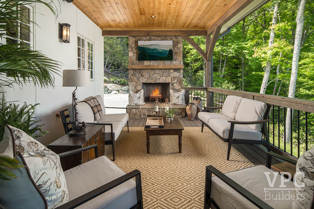 Country French Cottage deck seating with TV and fireplace