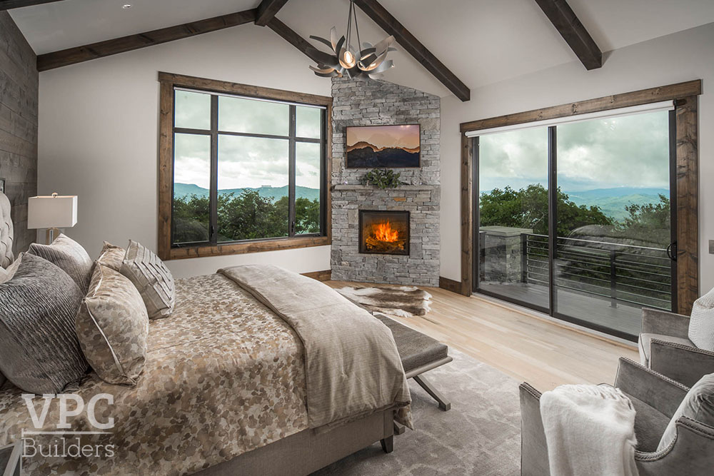Lodge Ridge bedroom with fireplace and TV