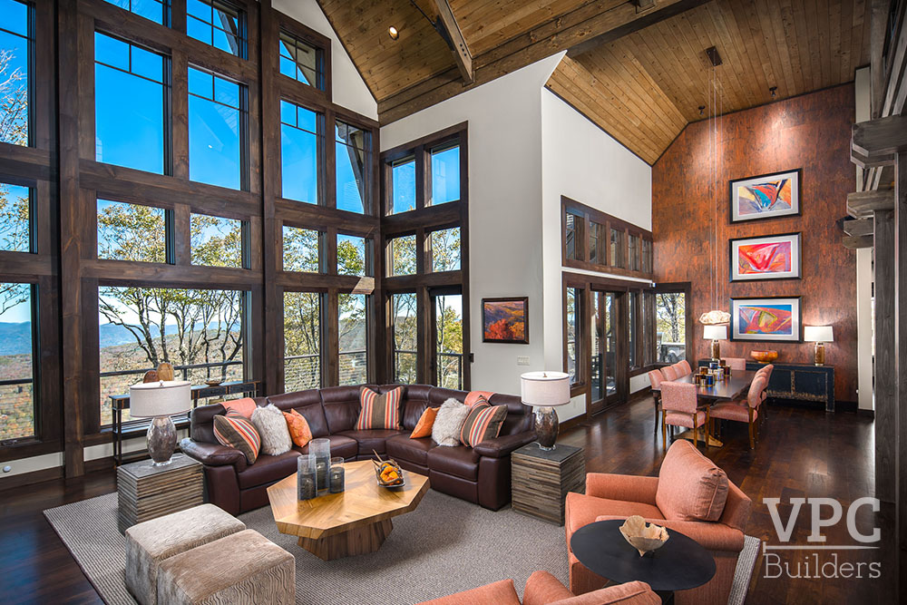 Ski Retreat living room with large window overlooking the mountains