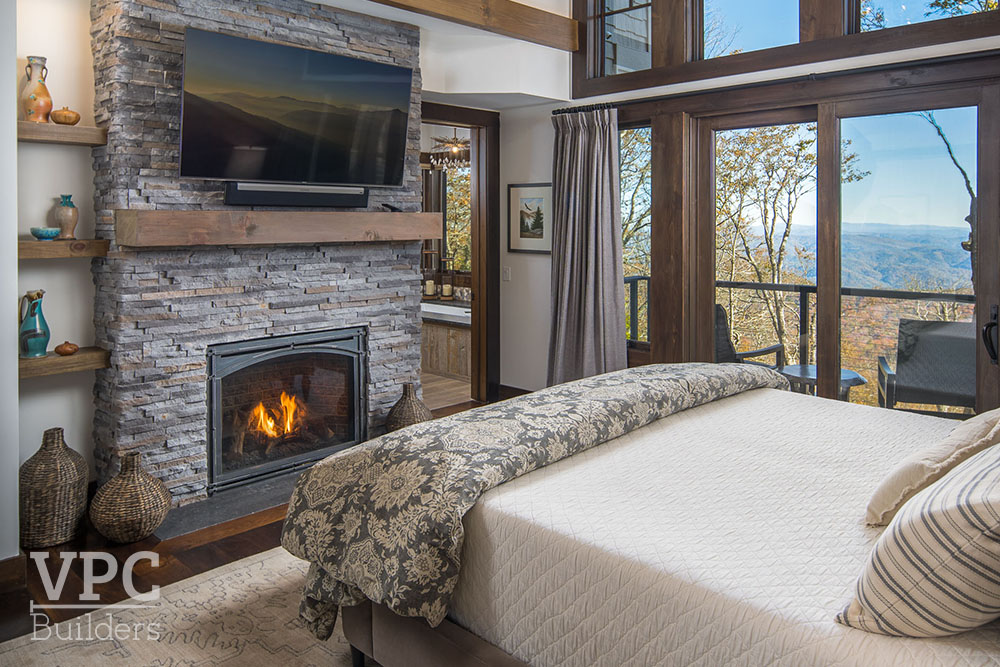 Ski Retreat bedroom with fireplace and television