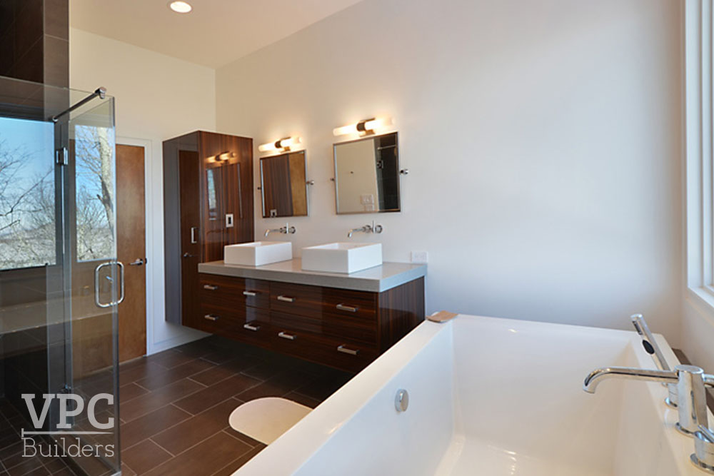 Modern Geothermal Home bathroom with tub and shower