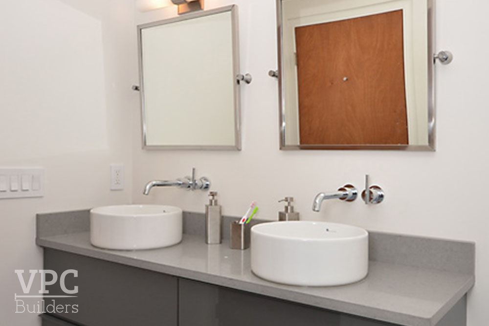 Modern Geothermal Home bathroom with vessel sinks