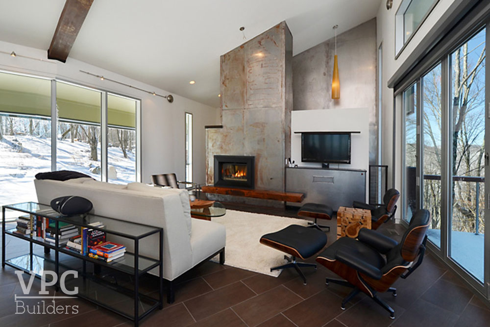 Modern Geothermal Home living room with fireplace and tv