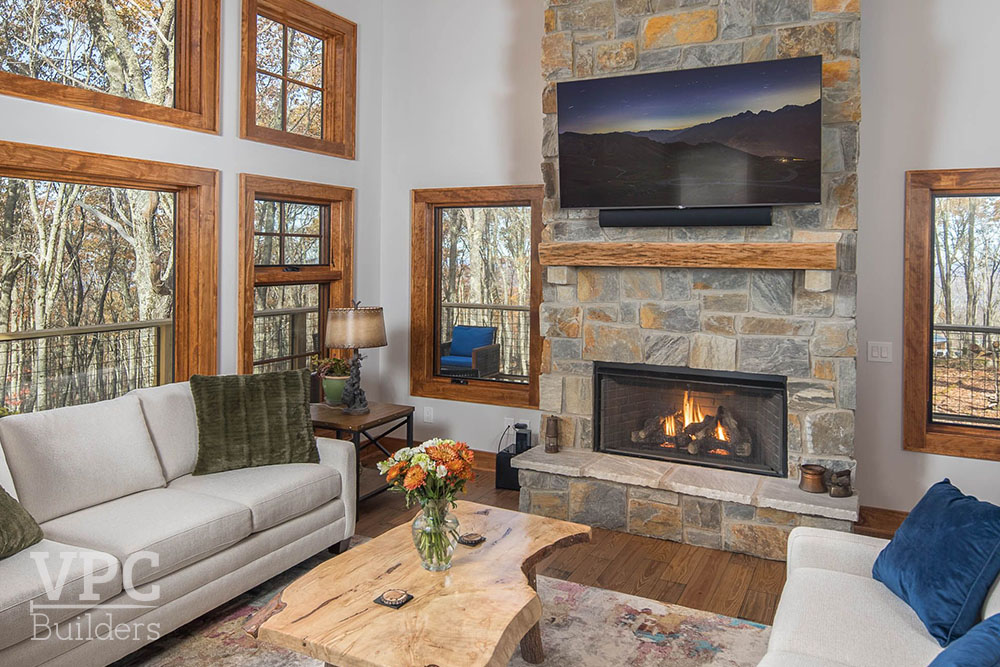 Rustic Mountain Residence living room with fireplace and tv