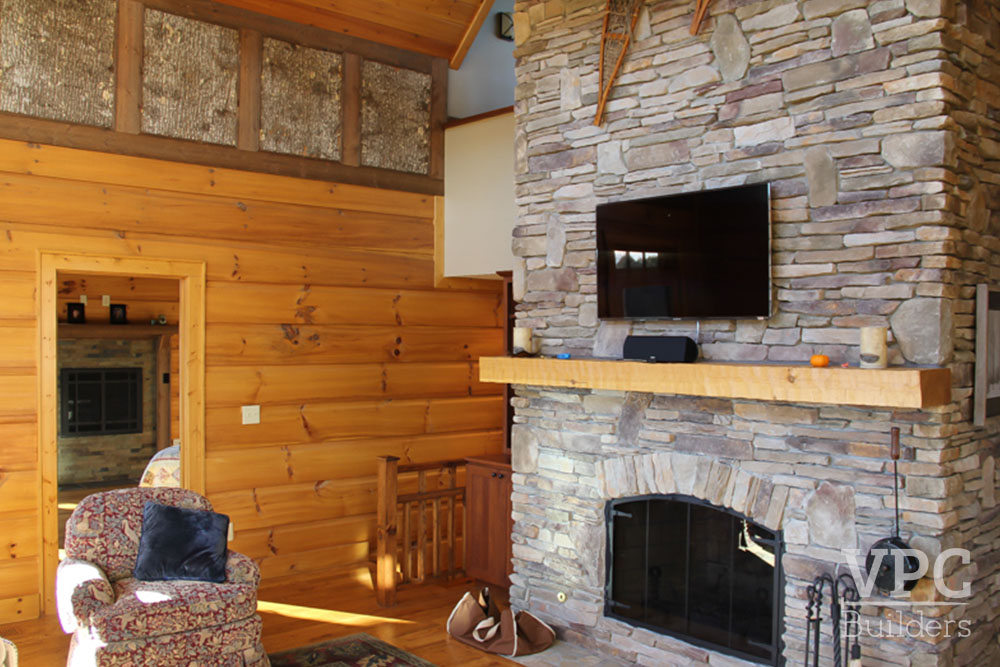 Sparta Custom Lodge living area with TV and fireplace