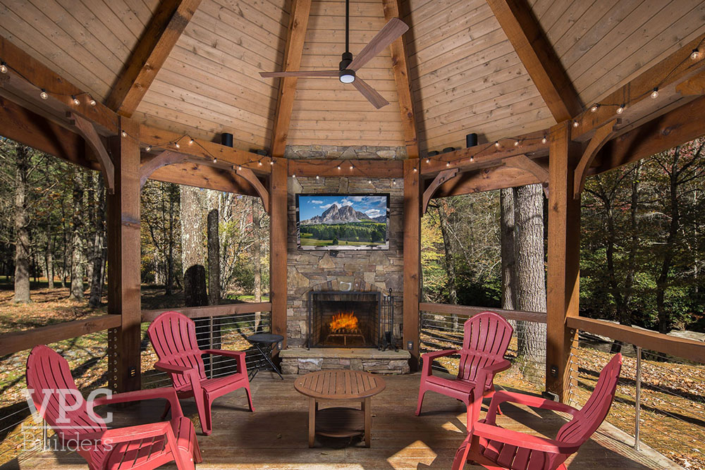 Twin Rivers Home porch with fireplace