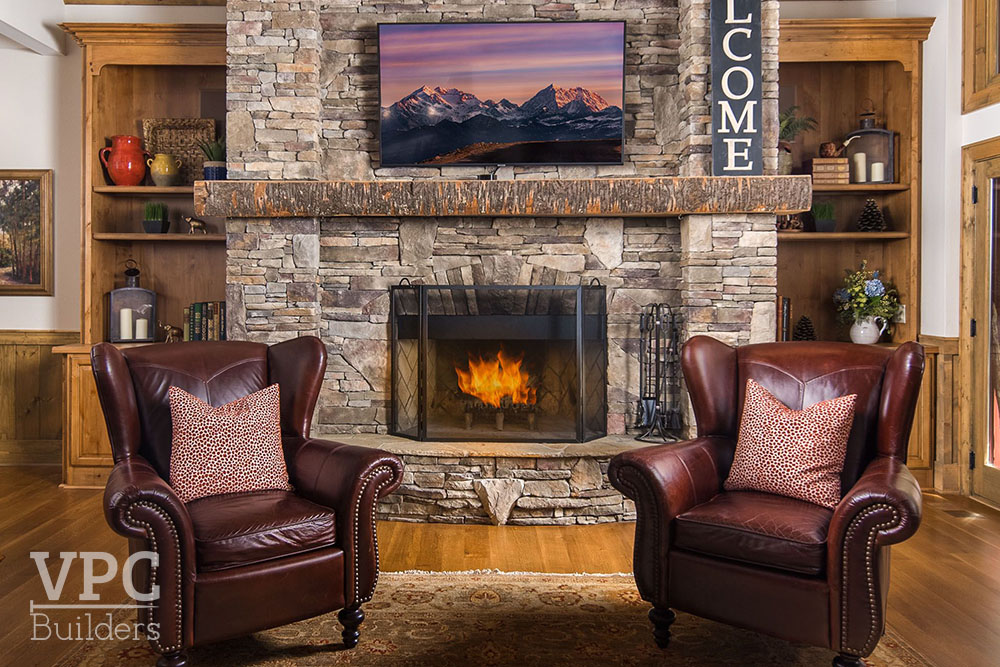 Twin Rivers Home seating by fireplace