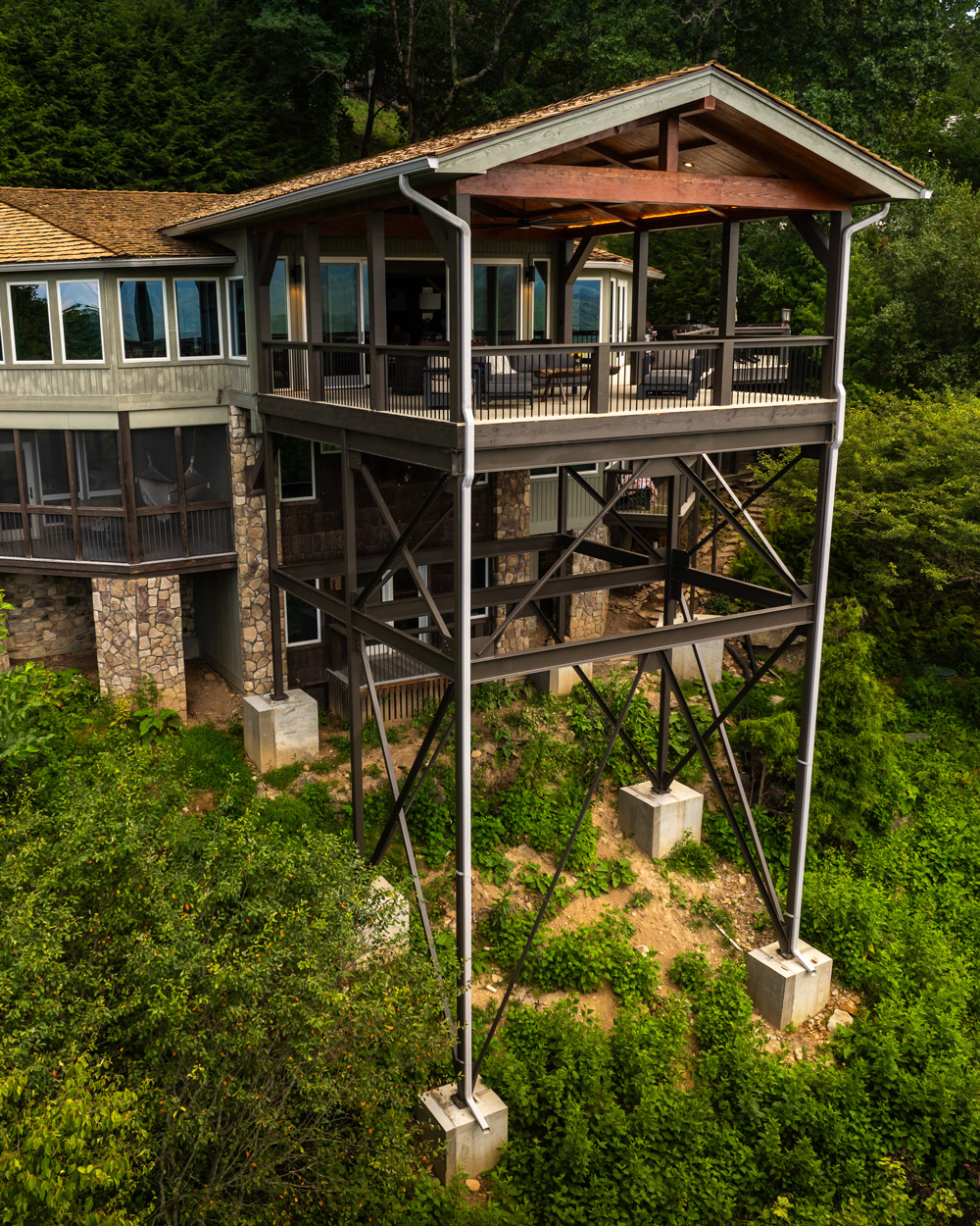 back patio deck scaffolding anchored into mountainside