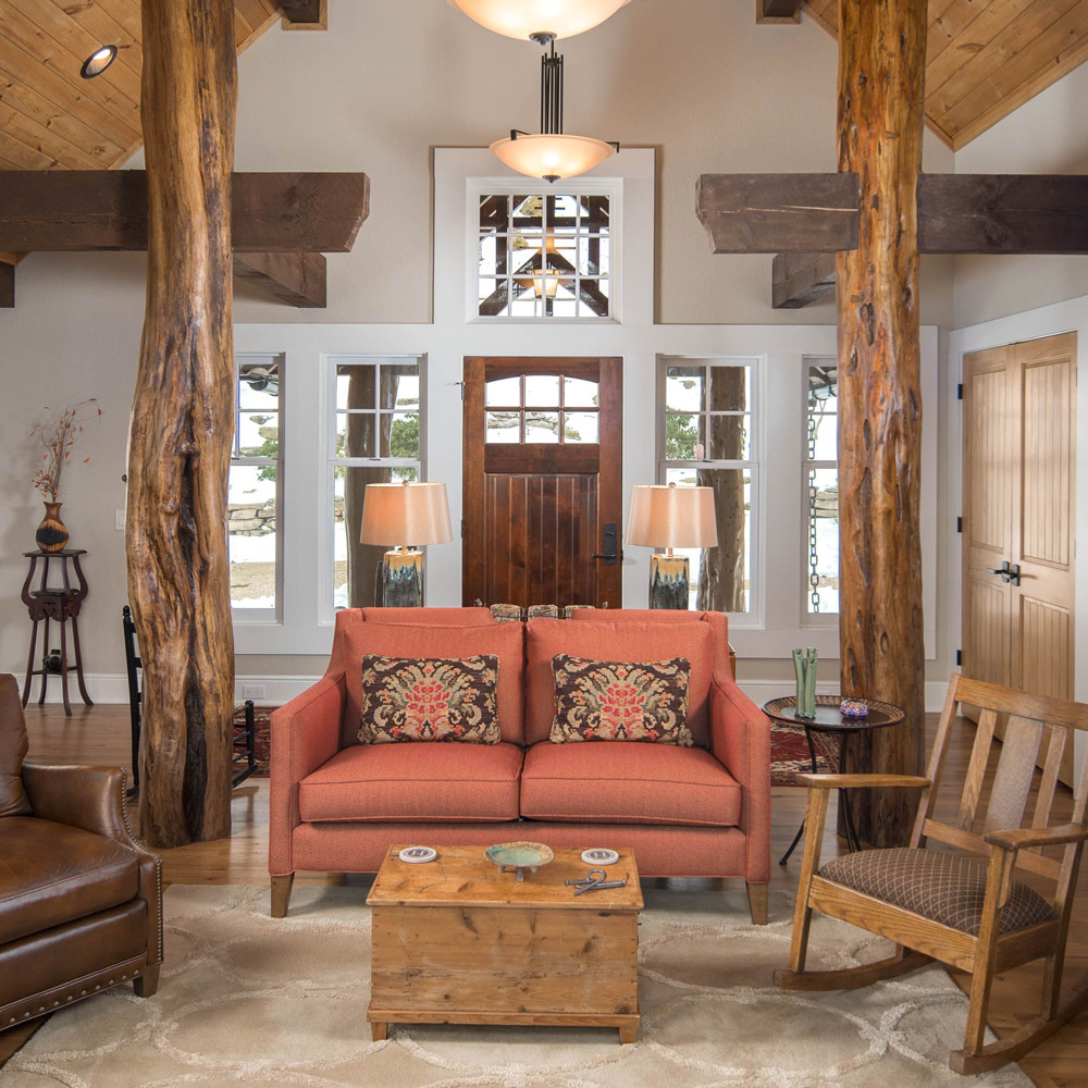 Interior view of the front entryway leading into the living room and sitting area.