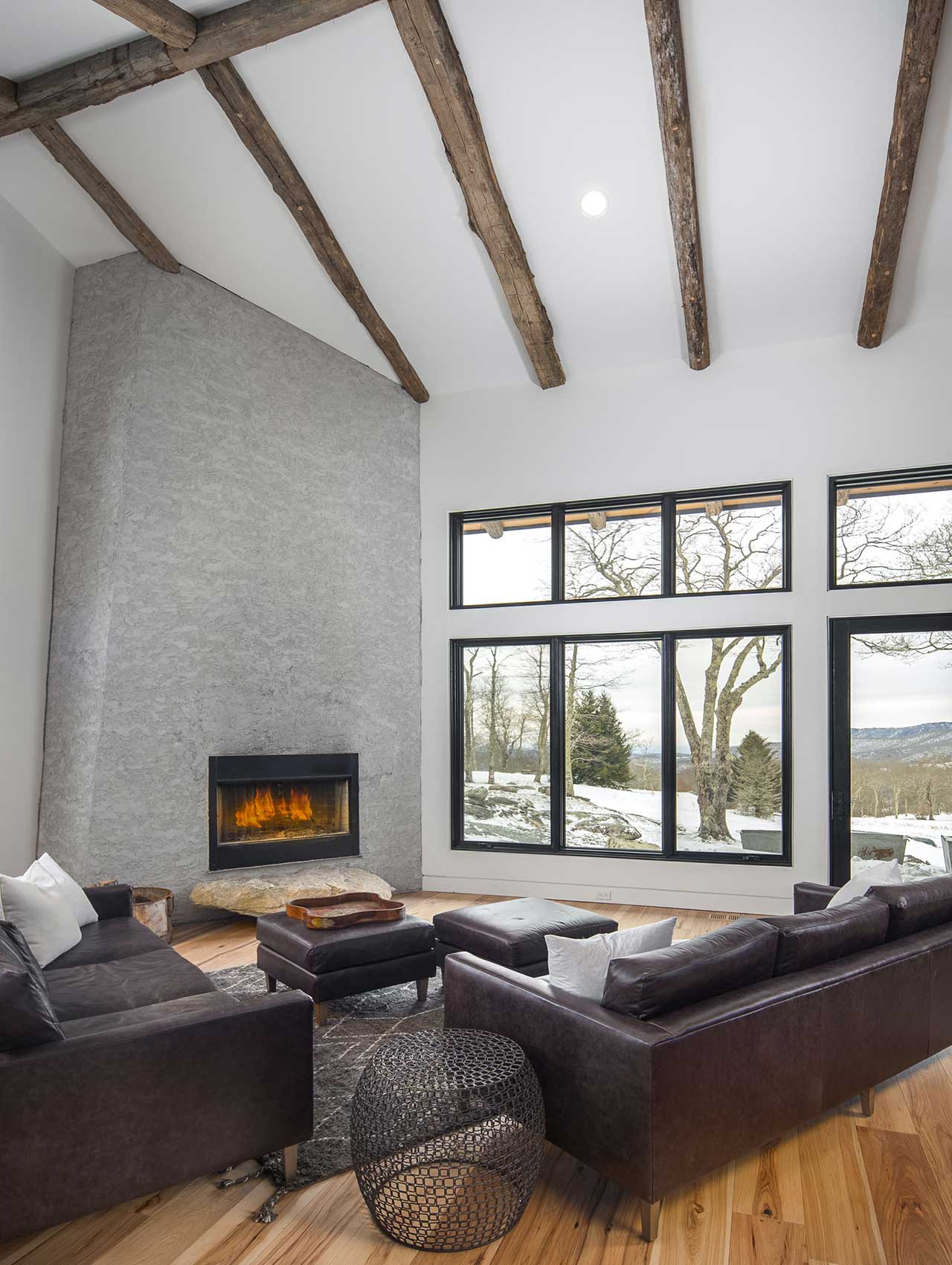 Living room with lots of windows, natural light and cathedral ceilings.