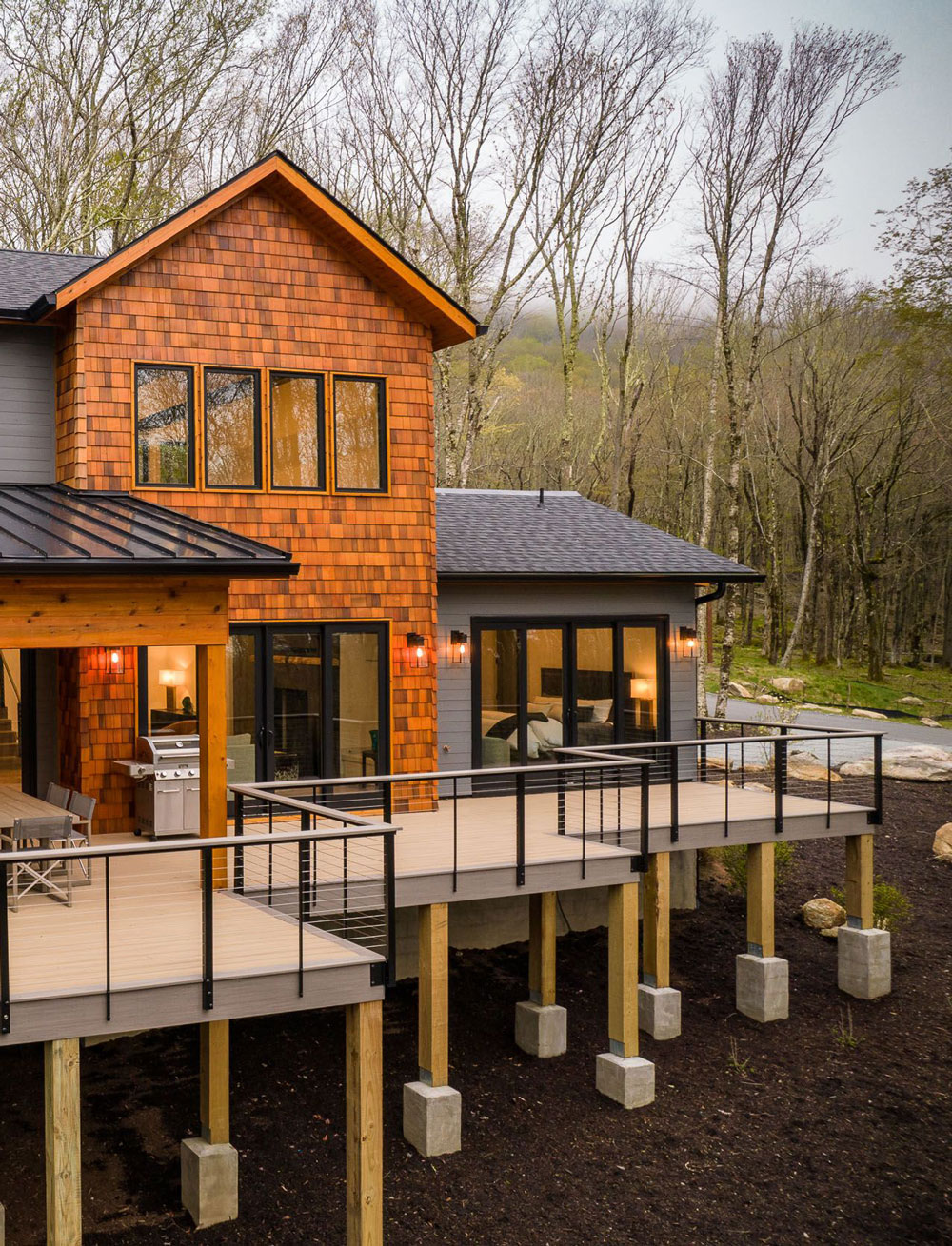 Steep wooded lot with custom home built into it. 