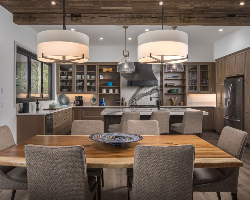 Custom kitchen with island seating and marble counter tops.