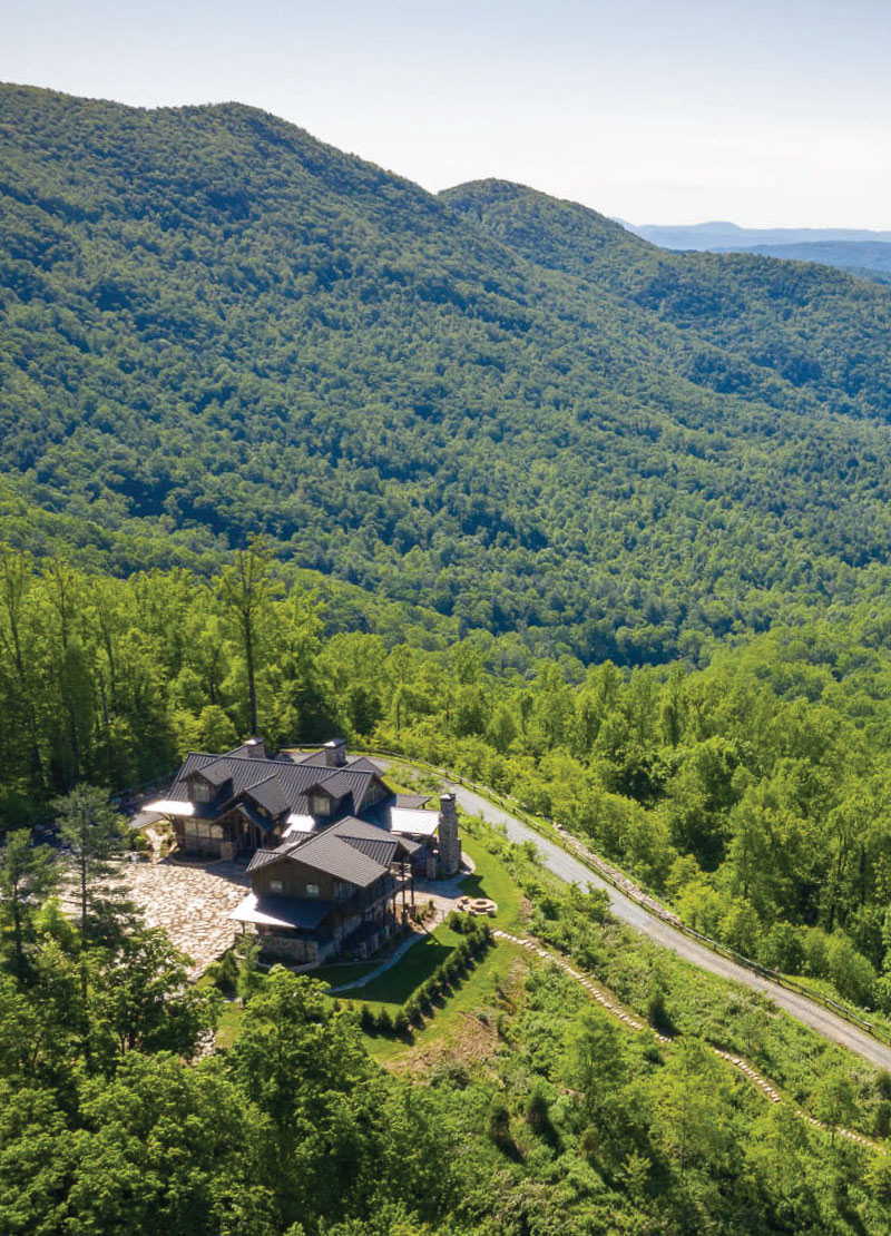 Aerial view of VPC home on mountain ridge.