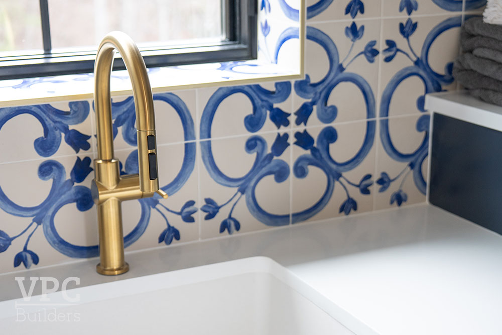 Antler Peak interior laundry sink Mediterranean tile backsplash